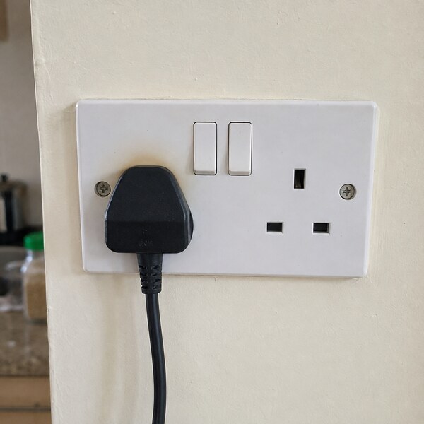 Hot electrical socket showing signs of discolouration